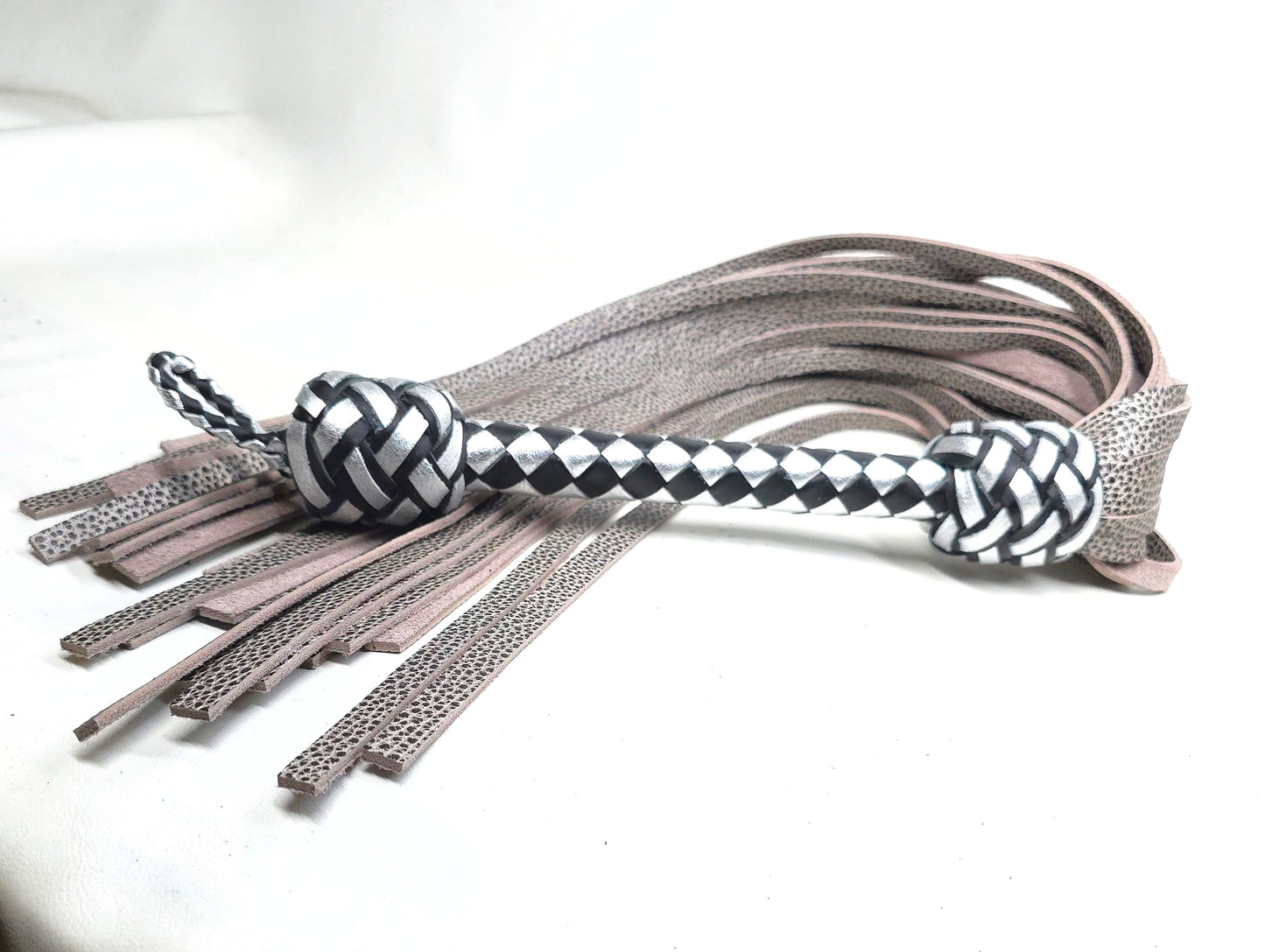 Black and silver water buffalo flogger