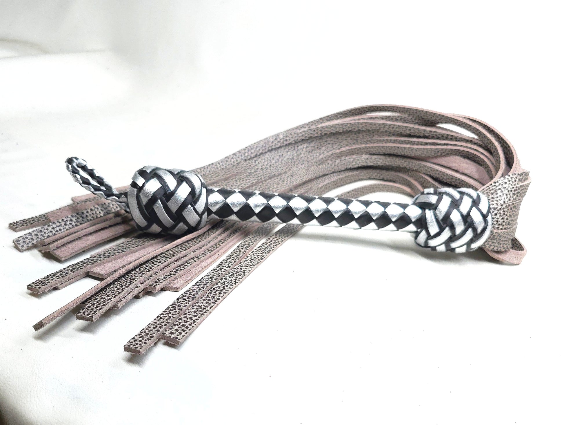 Black and silver water buffalo flogger