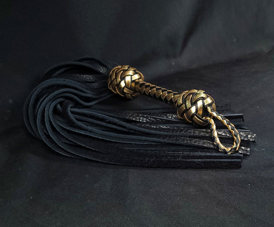 Black and gold leather flogger