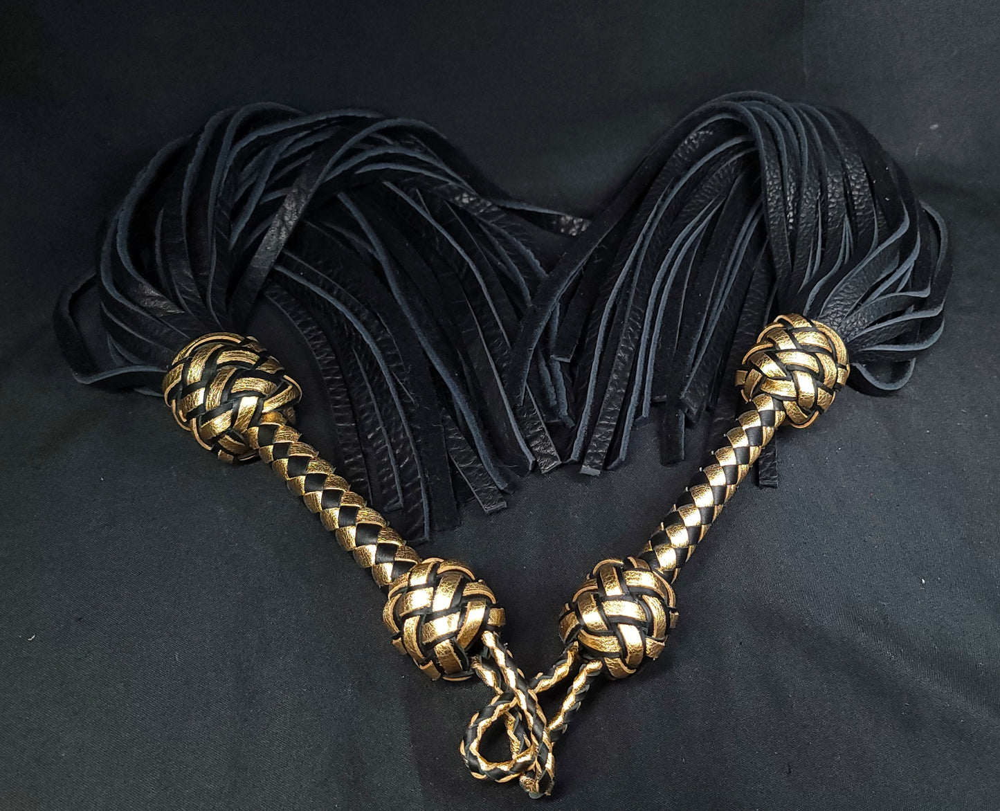 Two Black and Gold BDSM Floggers in the shape of a heart