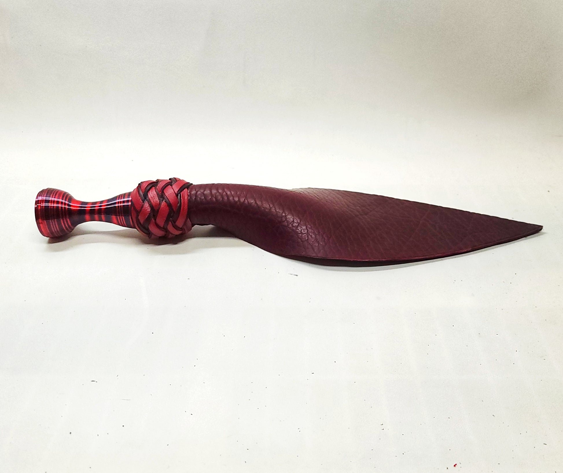 leather spanking toy for BDSM impact play made in oxblood bison leather