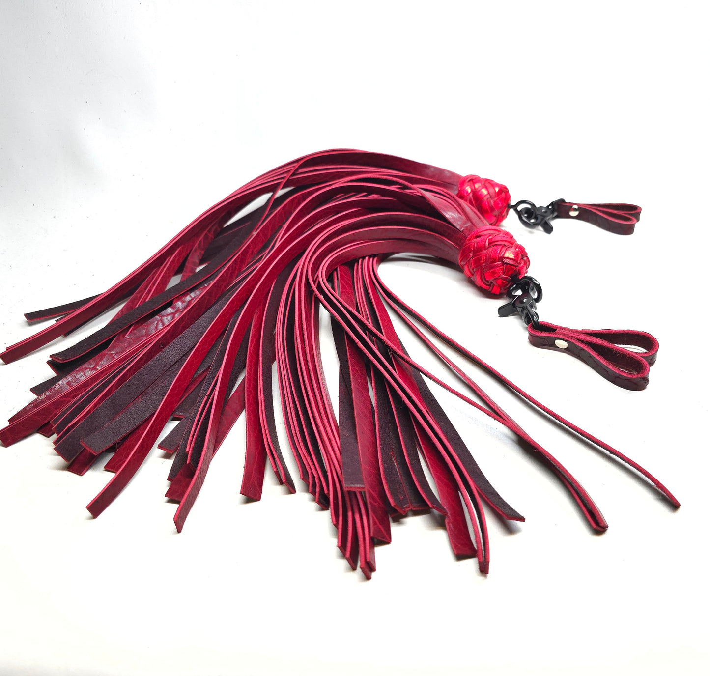 oxblood red swivel finger floggers for impact play